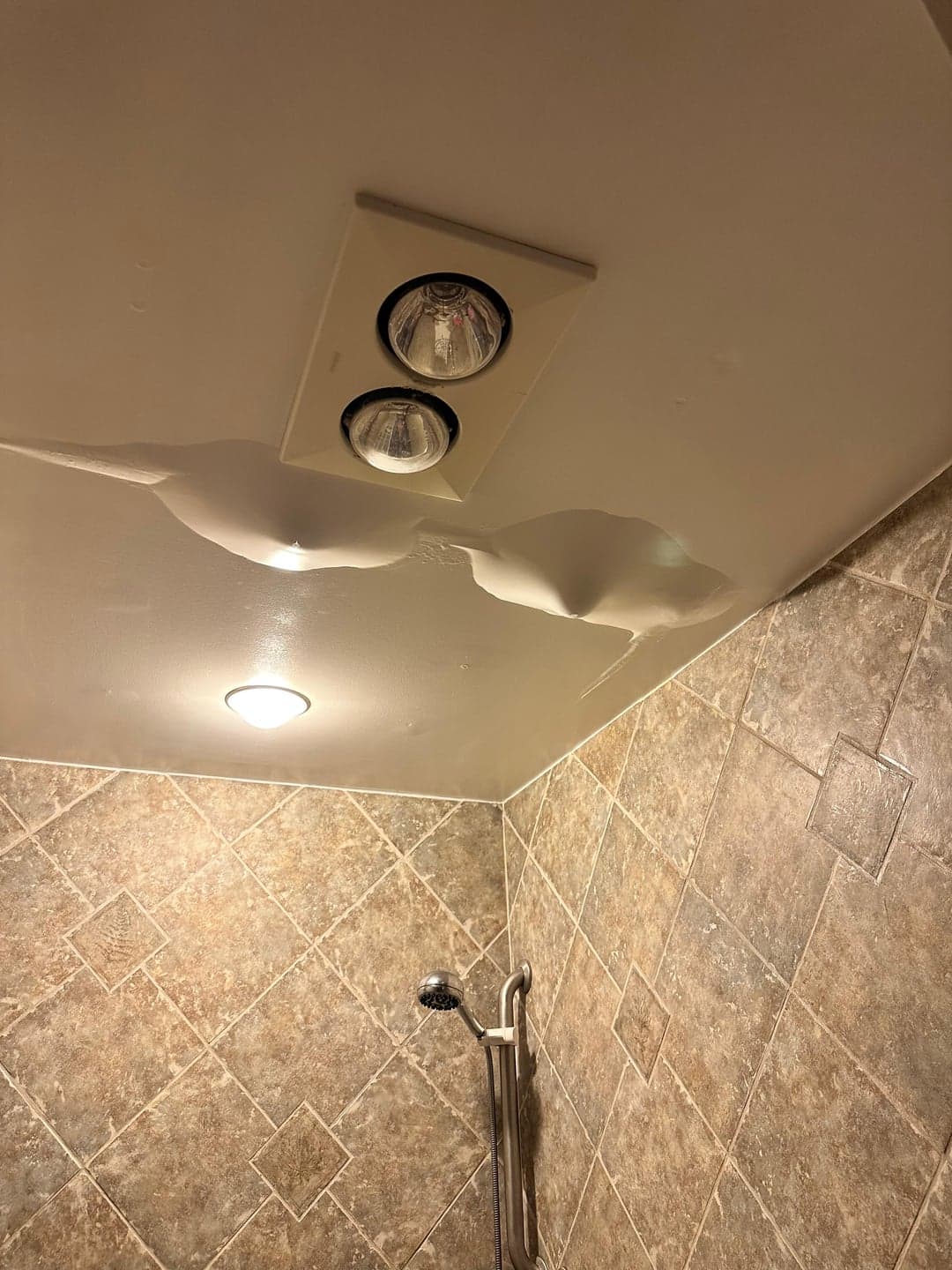 Water leaking from an AC indoor unit causing ceiling damage