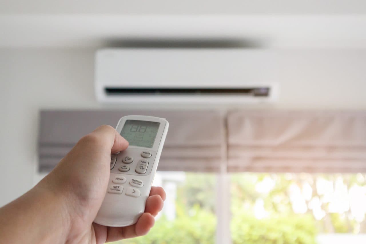 Technician diagnosing an AC that is running but not cooling