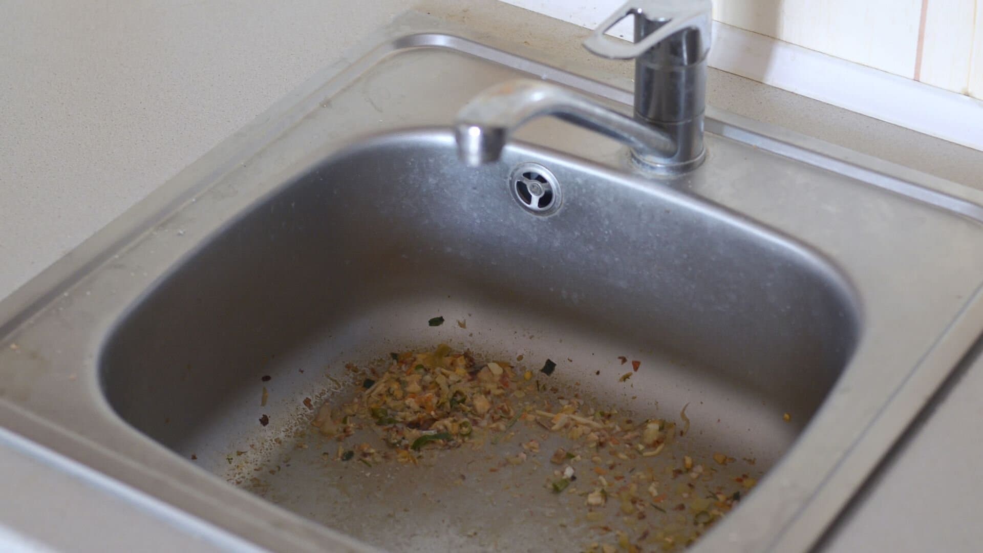 Blocked kitchen drain with clogged sink