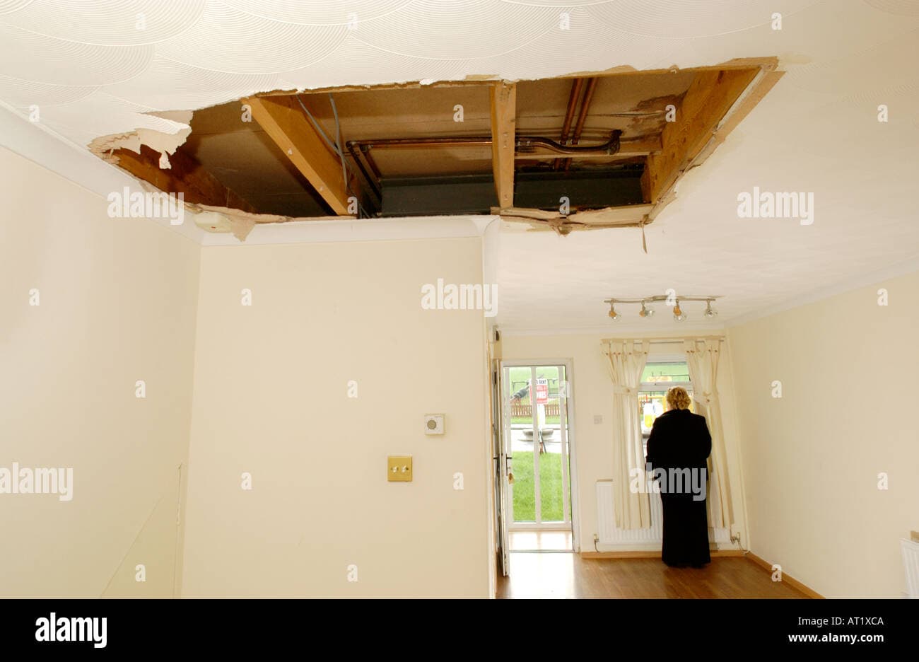 Water leak damage on a wall and ceiling in a Dubai home