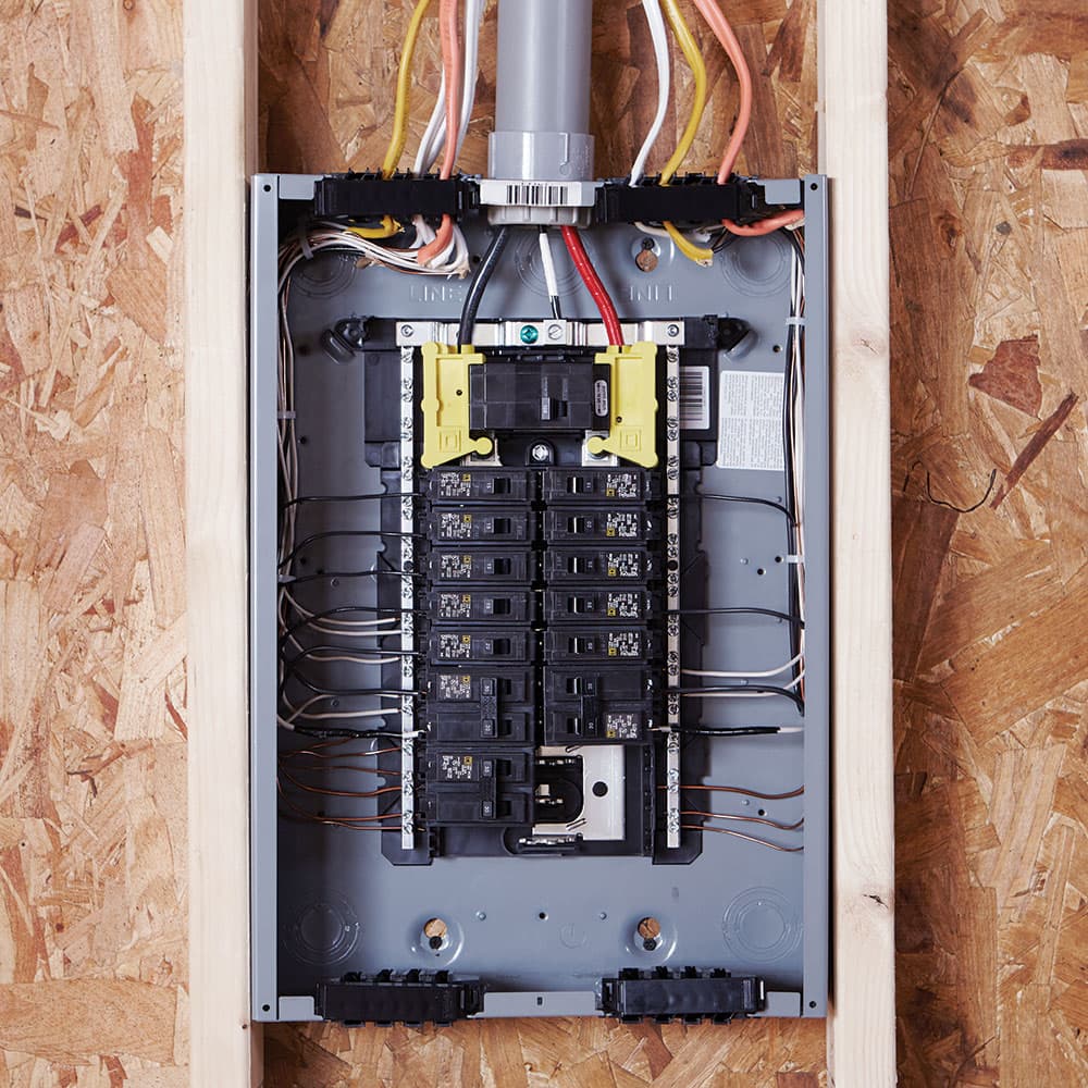Emergency electrician diagnosing a circuit fault at night